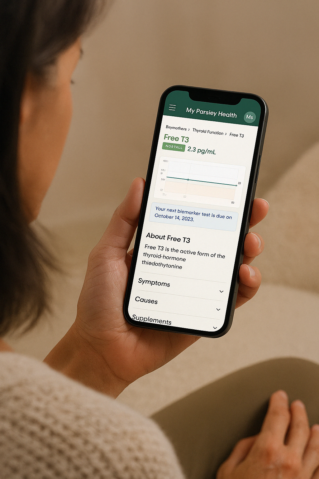 Woman checking thyroid function results on the Parsley Health mobile app